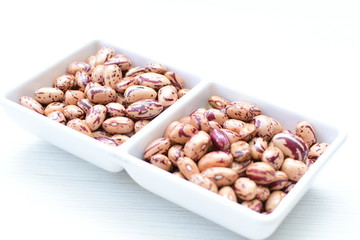 Raw bean grains (Phaseolus vulgaris) displayed in bowl