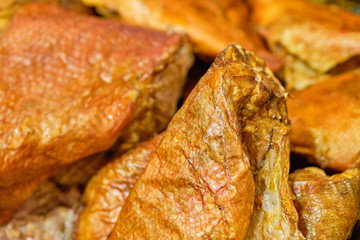 Smoked fish on the counter of the store.