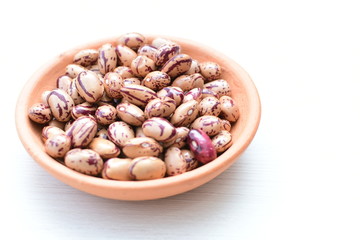 Raw bean grains (Phaseolus vulgaris) displayed in bowl
