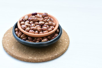 Raw bean grains (Phaseolus vulgaris) displayed in bowl