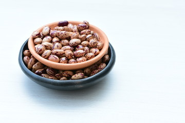 Raw bean grains (Phaseolus vulgaris) displayed in bowl