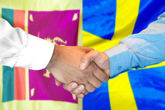Business handshake on the background of two flags. Men handshake on the background of the Sri Lanka and Sweden flag. Support concept
