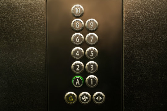 Closeup of metal buttons in an elevator
