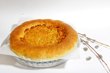 Large baked meat pie on a white background