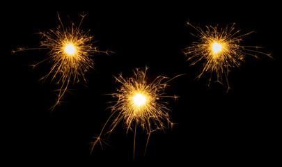 Set of new year, christmas or festive sparkler, sparkler firework candles isolated on black. Party dark background.