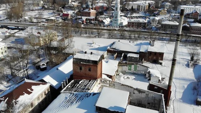 Slow cinematic flight by the Russian Church ("Church of the Resurrection on the Debra") in Kostroma on a clear winter day. View of the Church, bell tower and city.