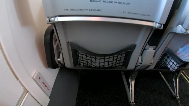 Passenger seat and window in a commercial airplane cabin