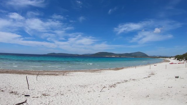 Panoramic view of Maria Pia beach on a sunny day. Sardinia, Italy