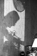 Shadows on the wall. Silhouette of a waiter.