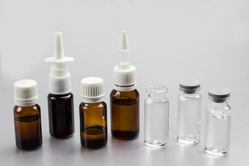 Glass Bottle with medicines. Medical concepts and medicines. Copy space. Top view. Gray background