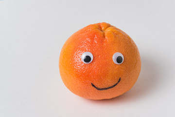 Orange-smile on white background. Food with Funny Faces. creative idea.