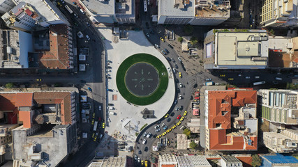 Aerial photo of recently renovated fountain of famous round square of Omonia in the heart of Athens centre, Attica, Greece