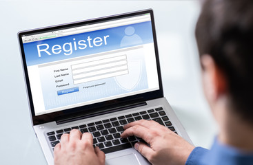 Obraz na płótnie Canvas Businessman Filling Online Registration Form