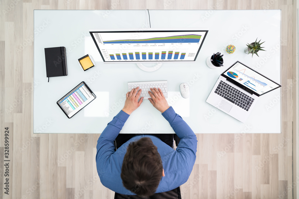 Poster Businessman Working With Graphs On Computer