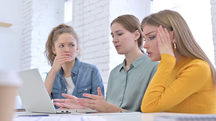 Fototapeta premium Female Startup Team Disappointed by Failure on Laptop