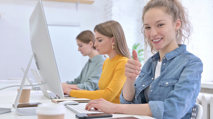 Working Woman with Curly Hairs Showing Thumbs Up