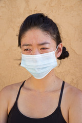 Asian Woman Wearing Disposable Face Mask