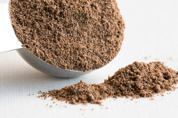 Ground Allspice Spilled from a Teaspoon