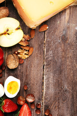 Allergy food concept. Allergy food as almonds, milk, cheese, strawberry, bread, seeds, eggs, peanuts and .crustaceans or shrimps on background