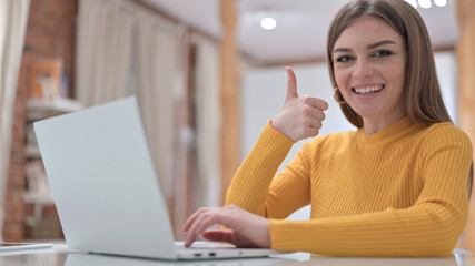 Ambitious Creative Young Woman doing Thumbs Up in Office