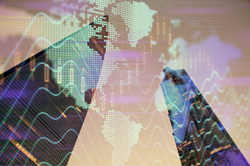 Forex chart on cityscape with tall buildings background multi exposure. Financial research concept.