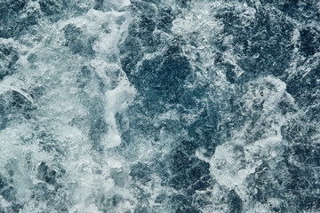 Raging blue water, splashes, bubbles