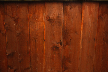 Fototapeta na wymiar Orange wood fence plank texture background.