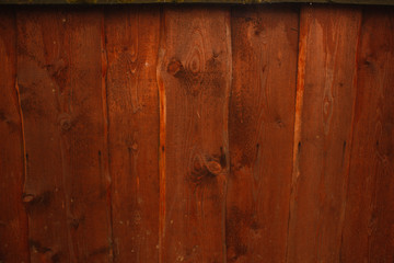 Orange wood fence plank texture background.