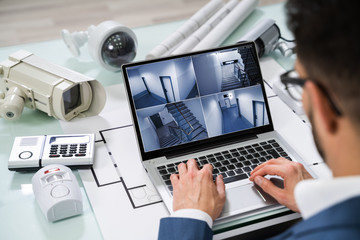 Person Watching Footage On Digital Tablet