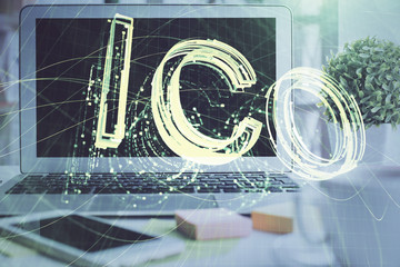 Multi exposure of blockchain and crypto economy theme hologram and table with computer background....