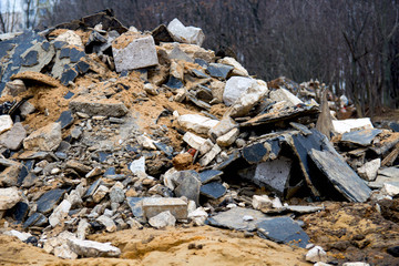 Pollution of nature. Trash and garbage, environmental hazard. Mountain of garbage in an old tree in the leaves. garbage from glasses from bottles on the nature.