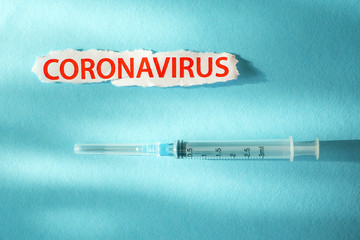 Coronavirus word and syringe for injection. Conceptual. Healthcare to aid recovery from coronavirus COVID-19. Developing vaccine background. Vaccine injection