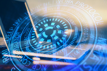 Double exposure of desktop computer and technology theme hologram. Concept of software development.