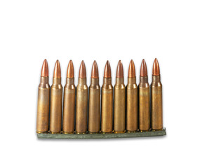 Row of standing 5.56mm M16 assault rifle cartridges isolated