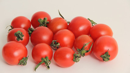 fresh cherry tomatoes on white background