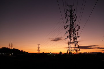 Electric wire standing at sunset