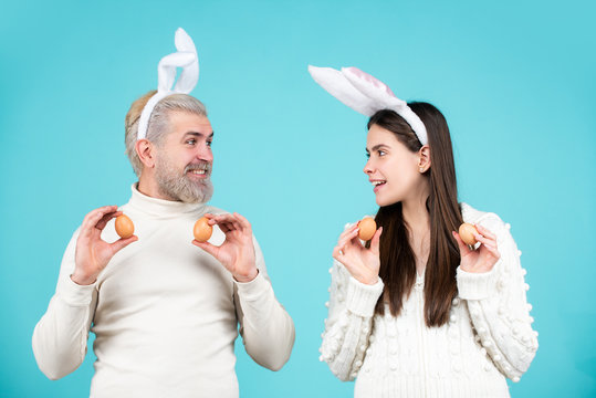 Easter family with Easter eggs. Holidays. Family celebrate Easter. Couple with eggs for Easter. Happy couple with bunny ears. Bunny couple with Bunny ears.