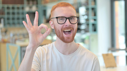 Portrait of Ok Sign by Cheerful Redhead Man
