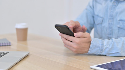 Hands of Man using Smartphone, Close up