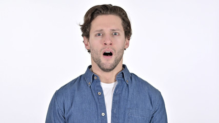 Stunned Young Man Feeling Shocked on White Background