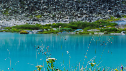sea bay with stone shore, turquoise lake in rocks, mountain river with blue water