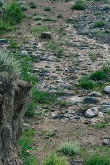 clay hillside with traces of soil erosion, climate change, loss of fertile land and pastures due to drought