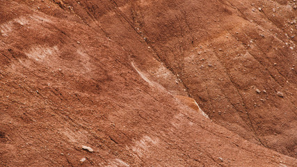 Red hills in canyon. Red colored rocks. Old bed of river in gorge