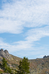rock ridge under blue cloudy sky, mountain tourism, tourist area for relaxation