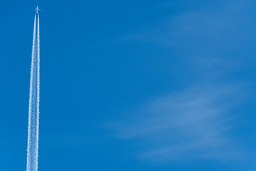 trail of plane flying in blue sky