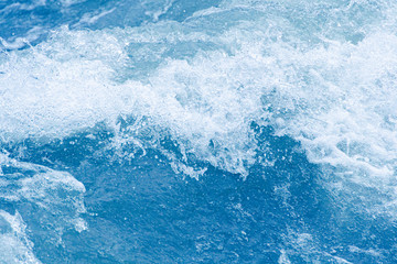 Fototapeta na wymiar Blue ocean waves, tide. Swift current of river