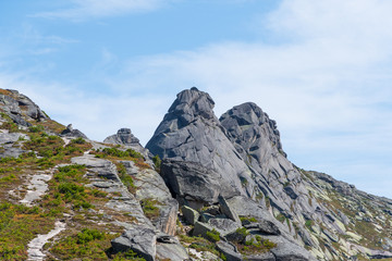 rock ridge under blue cloudy sky, mountain tourism, tourist area for relaxation