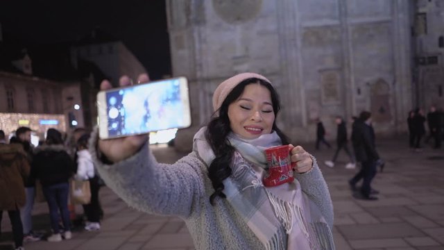 Beautiful asian mid aged woman taking selfies outdoor