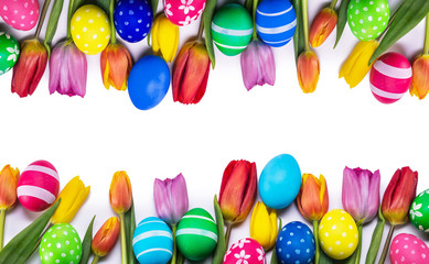 easter eggs and tulips on white