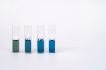 The reagent in glass or quartz cuvettes on isolated white background
